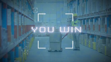 Poster - Animation of you win text in viewfinder, caucasian man placing cardboard boxes in warehouse
