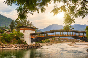 Wall Mural - Wooden bridge at Punakha Dzong and the Mo Chhu river in Bhutan