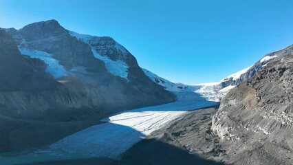 Poster - Drone view of a glacier in the Rocky Mountains. Banff National Park, Alberta, Canada. Landscape from the air. Video for background.