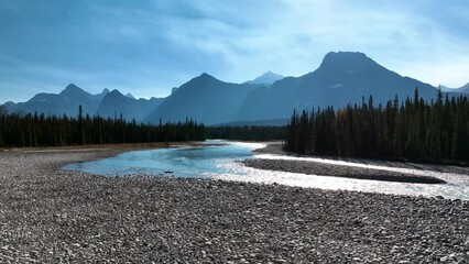 Wall Mural - canada. a drone view of the river in the mountains valley. an aerial view of a forest. winding river