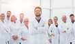 © ASDF - confident scientific leader standing in front of a team of young scientists.