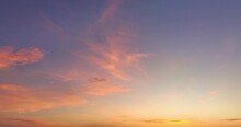 .Aerial View Red Clouds Float In The Morning Blue Sky..colorful Sky Of Sunset Sunrise 4K Shooting With Drone..sweet Pink Cloud With Purple Shadow In Blue Sky During Beautiful Sunrise.Gradient Color.
