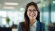 © Fred - Smiling female economist wearing glasses.