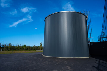 Large round grey tank with a ladder.