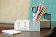01 September. Image of september 1 wooden calendar on desktop. Autumn day. Back to school. Pencils and paints, stationery.