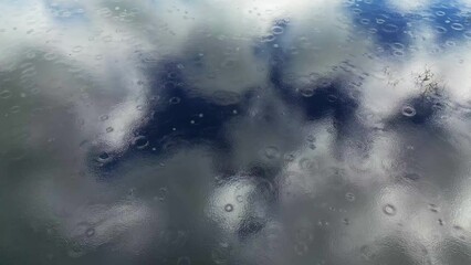 Wall Mural - aerial top view of sky with clouds reflection in water of lake, rings of rain drops, abstract backgr