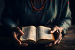 Hands hold an open Bible, capturing a moment of reverence and connection to sacred teachings. 