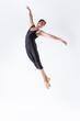 © danmorgan12 - Ballet Dancer Young Man in Black Dance Suit Posing in Flying Ballanced Dance Pose Studio.