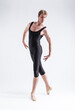 © danmorgan12 - Sports Concepts. Athletic Caucasian Dancing Ballet Man Posing in Stretching Pose with Circled Hands in Black Tights