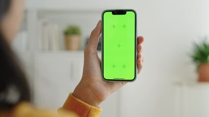 Blank digital smartphone in hand of Asia women, Mobile phone green screen 