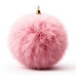 A pink fluffy ball ornament on a white surface. Digital image.