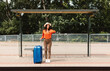 © Prostock-studio - Worried Passenger Woman Waiting For Delayed Bus At Station Outside