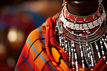 A dramatic portrait of a Maasai woman with beaded accessories and traditional clothing