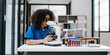 © Nuttapong punna - Modern medical research laboratory. female scientist working with micro pipettes analyzing biochemical samples, advanced science chemical laboratory .