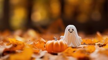 Halloween Decoration Featuring A Cute Ghost Miniature And Pumpkin Set Against An Autumn Leaf Background