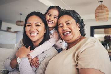 Wall Mural - Hug, women and generations with portrait of family on sofa for smile, bonding and support. Happy, relax and grandparent with mother and child in living room at home for calm, care and peace together