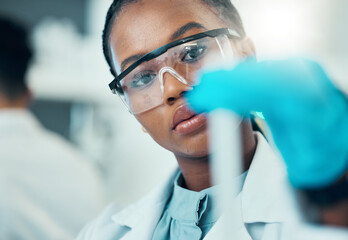 Wall Mural - Science, study and black woman with test tube in laboratory, medical engineer and results. Biotechnology, pharmaceutical and research, scientist or lab technician checking vaccine solution in glass.