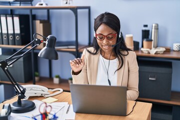 Canvas Print - Young african american woman call center agent having video call at office