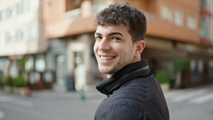 Canvas Print - Young hispanic man smiling confident at street