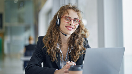 Sticker - Young woman business worker using laptop and headphones smiling at the office