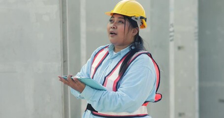 Wall Mural - Portrait African american woman. Plus size female factory worker wearing safety hard hat helmet working at heavy Prefabricated concrete walls manufacturing factory