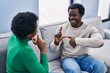 © Krakenimages.com - African american man and woman couple speaking with deaf language at home