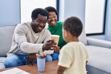 Canvas Print - African american family drinking water at home