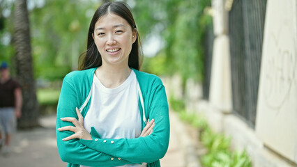 Sticker - Young chinese woman smiling confident standing at park