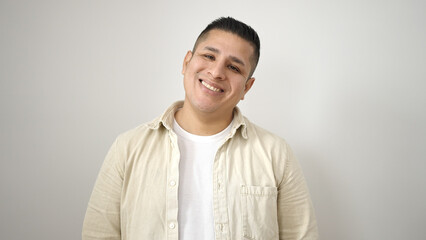 Wall Mural - Young hispanic man smiling confident standing over isolated white background