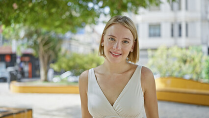 Poster - Young blonde woman smiling confident standing at park