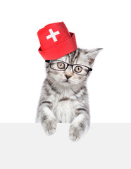 Aufkleber - Cat dressed like a doctor looks above empty white banner. isolated on white background