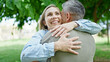 © Krakenimages.com - Man and woman couple hugging each other smiling at park