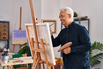 Canvas Print - Senior man smiling confident drawing at art studio