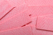 Sticks of pink chewing gum as background, top view