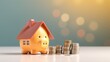 © JW Studio - piggy bank with coins piles and house model, concept of mortgage and savings, copy space.
