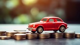 Fototapeta Mapy - Red car model toy on piles of coins with blurred background, concept of car finance, insurance and travel related issue.