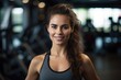 © Stitch - Sporty beautiful woman fitness trainer smiling in the gym