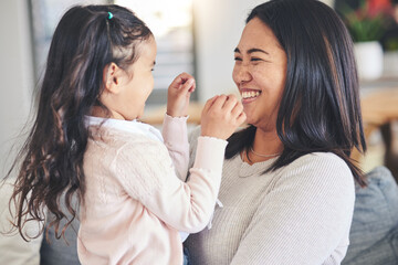 Poster - Funny, happy and playful with mother and daughter on sofa for love, care and support. Smile, calm and relax with woman and young girl embrace in living room of family home for peace, cute and bonding