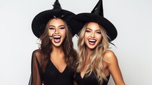 Two Happy Young Women In Black Witch Halloween Costumes On Party Over White Background Generative AI