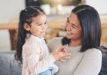 Poster - Hug, happy and playful with mother and daughter on sofa for love, care and support. Funny, calm and relax with woman and young girl embrace in living room of family home for peace, cute and bonding