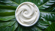 Natural cosmetic cream texture for body care on a green leaf. Natural organic cosmetics made of plants. Eco Skin care