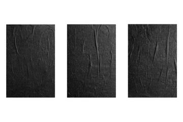 Three sheets of black paper with folds isolated on a white background.