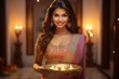 © artem - Happy Female Celebrating Diwali