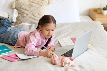 Sticker - Little girl with laptop studying computer sciences online in bedroom