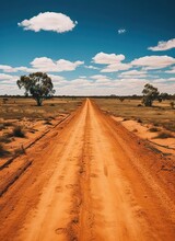 Dirt Road In The Australian Outback With Dry Grass And Trees
