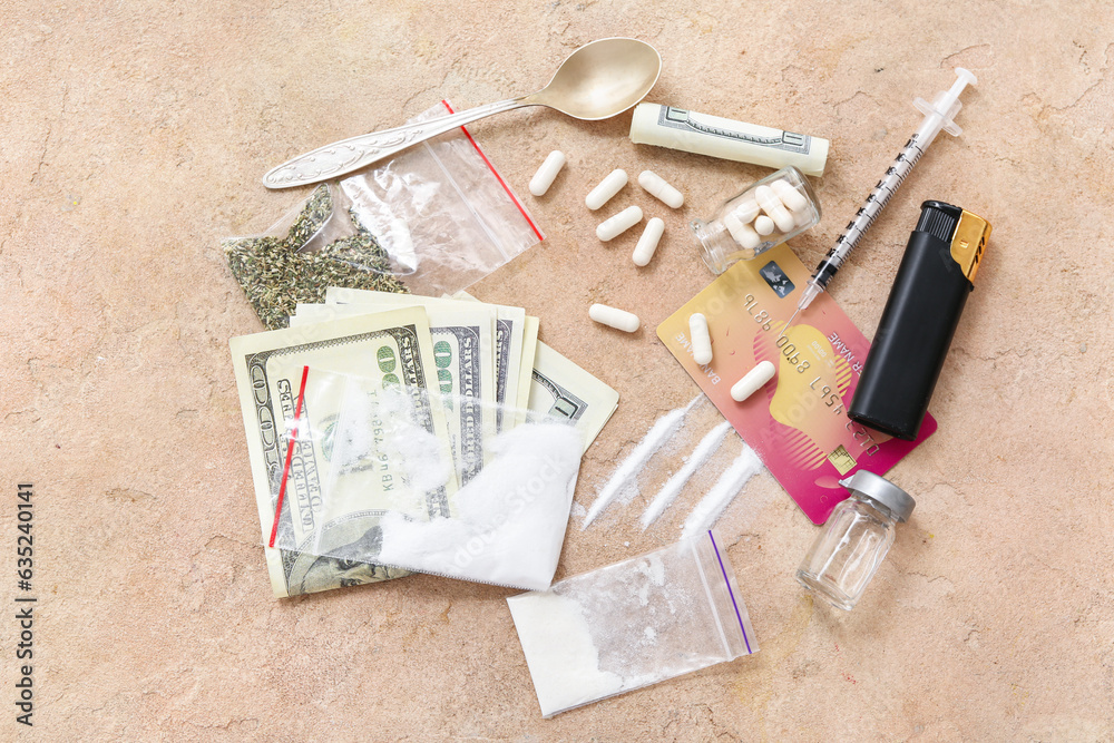 Composition with different drugs, money and lighter on color background