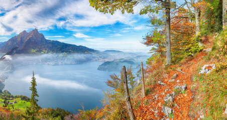 Wall Mural - breathtaking autumn view of stansstad city and lucerne lake with mountaines and fog.