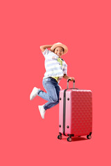 Poster - Little African-American boy jumping with suitcase on red background