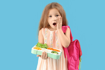 Poster - Shocked little girl with backpack and lunchbox on blue background