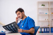© Elnur - Young male doctor radiologist working in the clinic